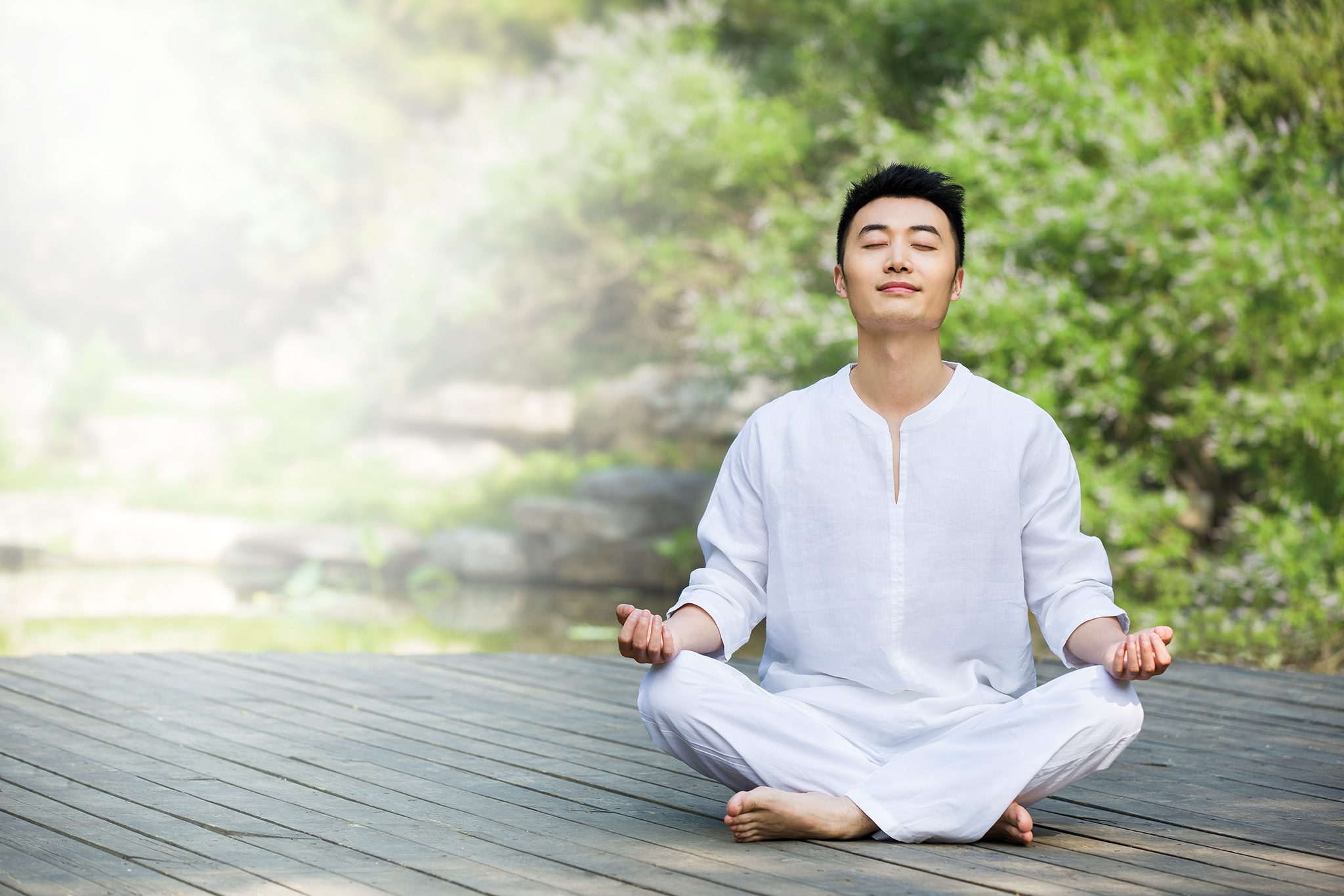 Asian man meditating