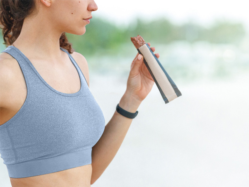 Women eating nutrition bar