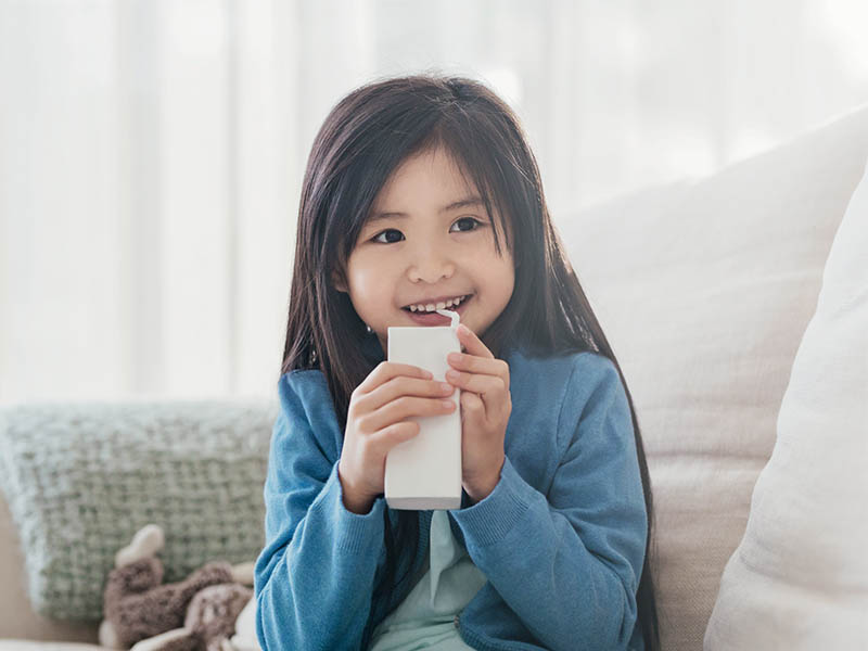 Child drinking tetrapak