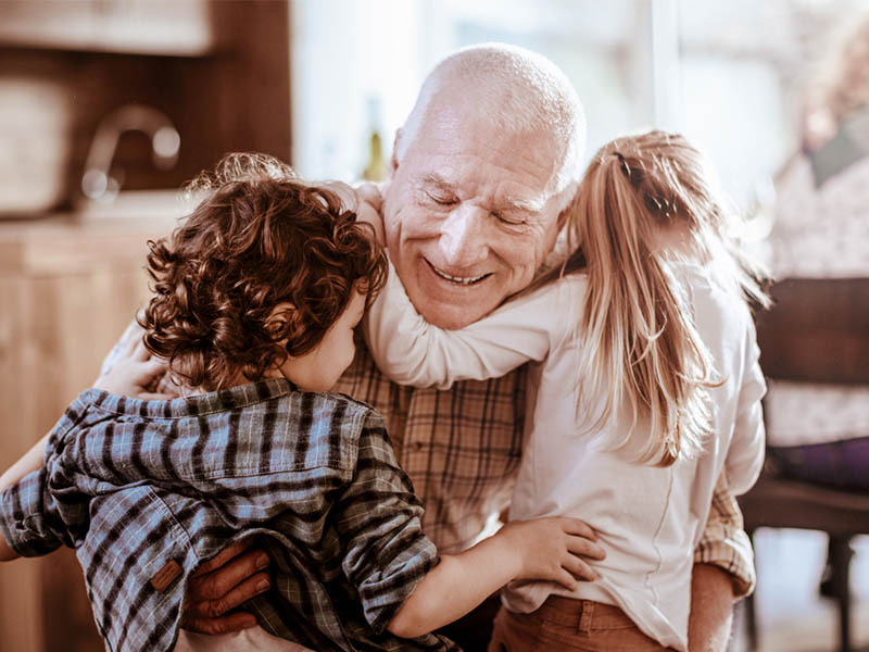 Granddad playing with grandchildren