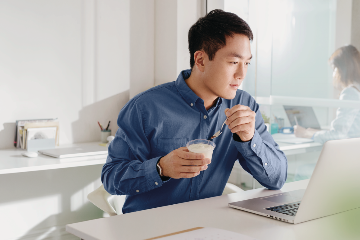 Man eating yoghurt